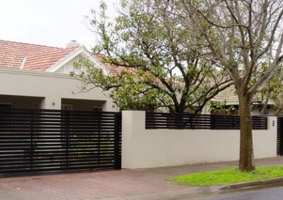 Leabrook Design; Horizontal Slats 65x16 with 10mm Gaps; Sliding Gate & Fence Panels between pillars; Satin Black; at Millswood