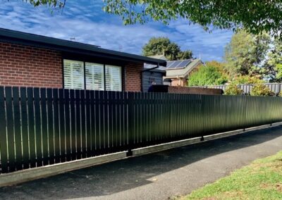 Stepney Design flat top picket fencing with 15mm gaps between 65mm pickets in satin black